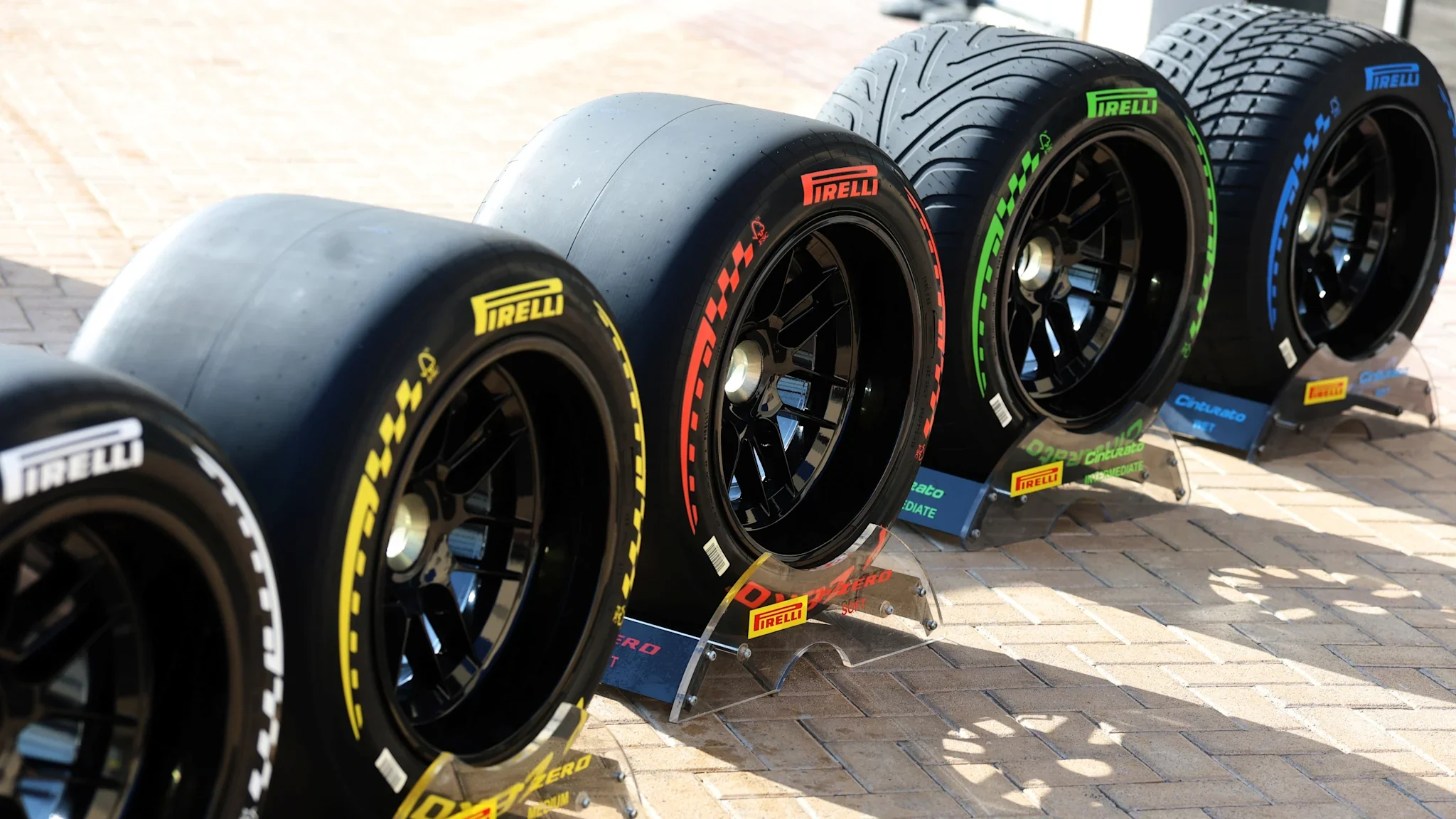 Five color-coded Pirelli Formula 1 tyre compounds displayed in a row