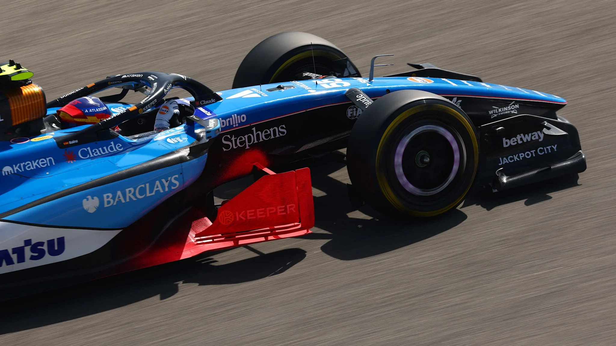 Alpine Formula 1 car running an aero rake behind the front wheel during 2026 testing