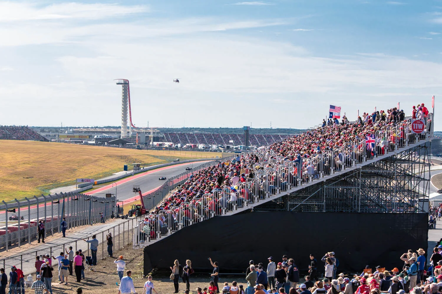 Crowded Turn 11 grandstand and COTA observation tower during the United States Grand Prix