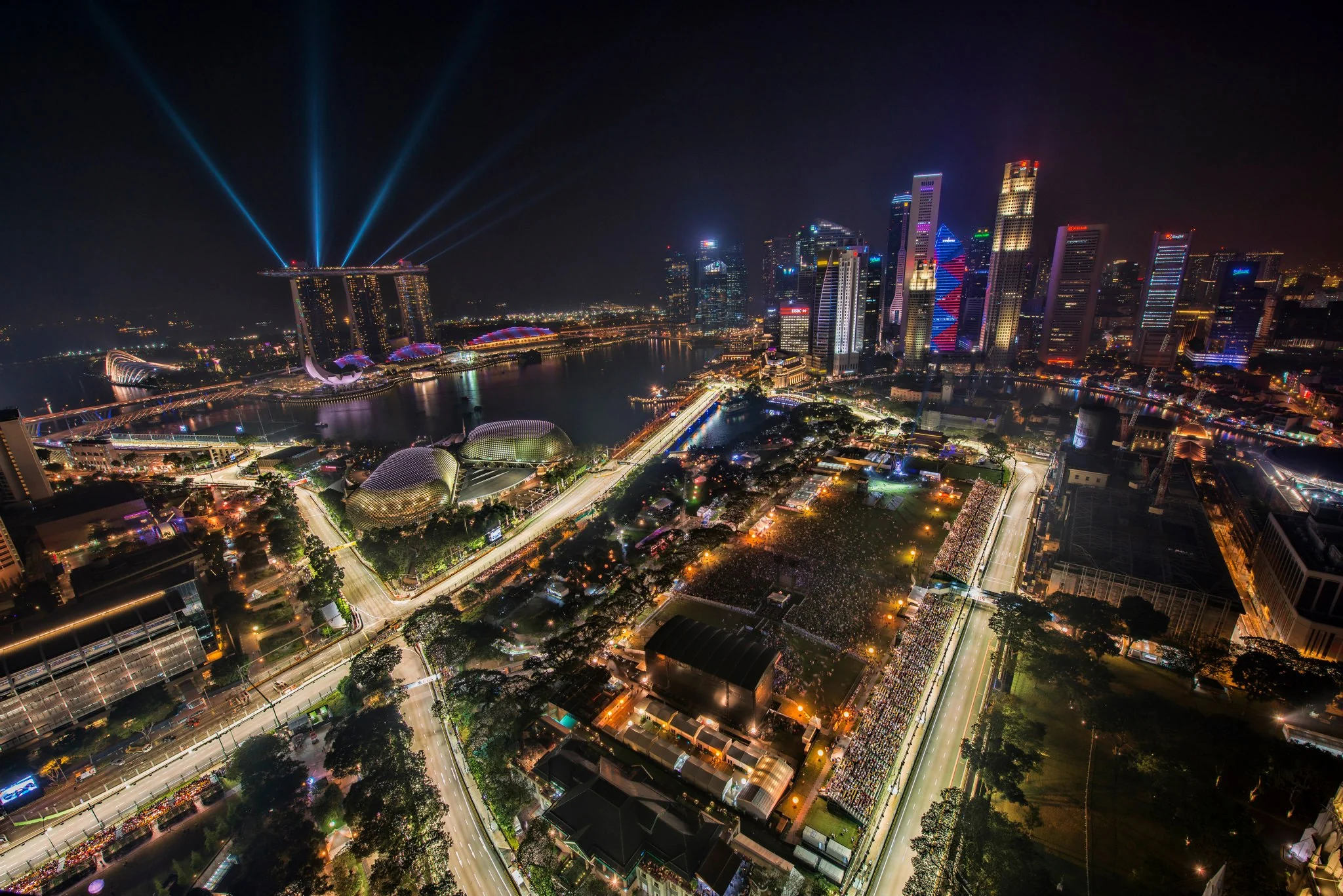 Illuminated Marina Bay circuit and Singapore skyline during a Formula 1 night race