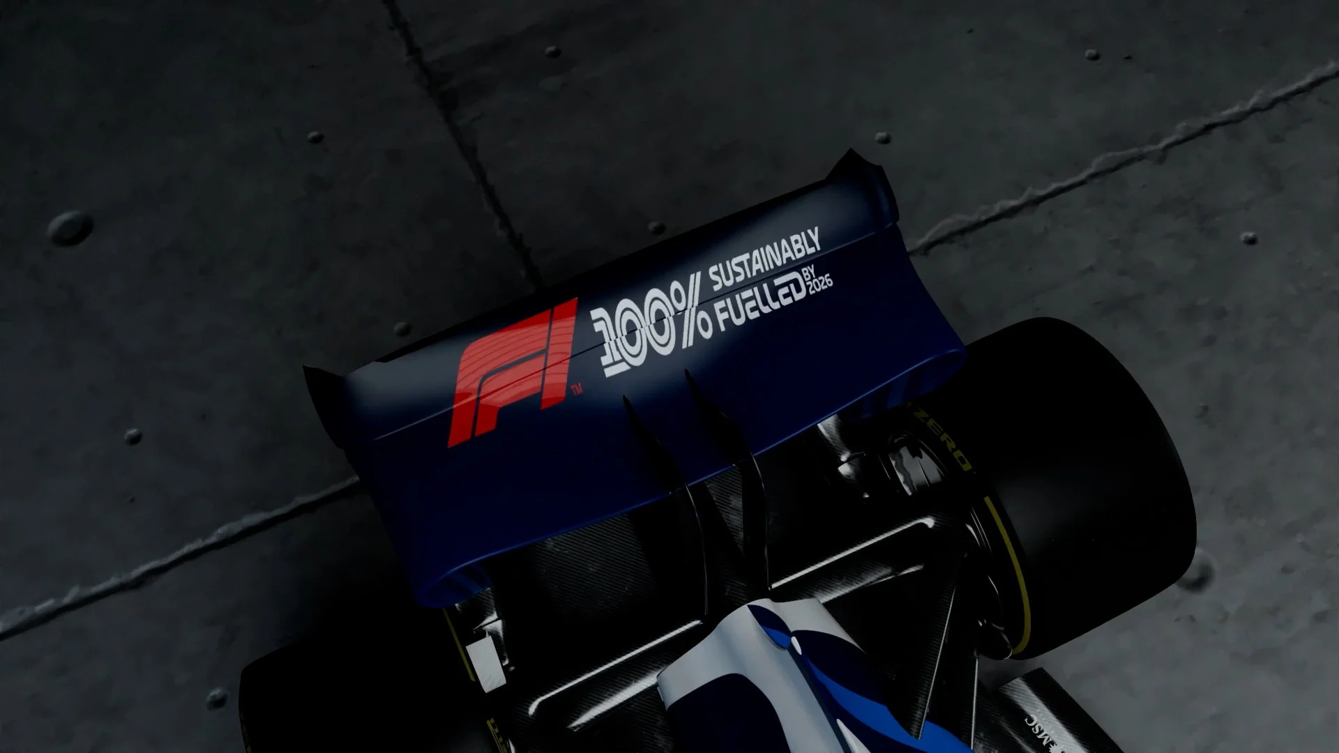 Close view of a Formula 1 car rear wing and tire