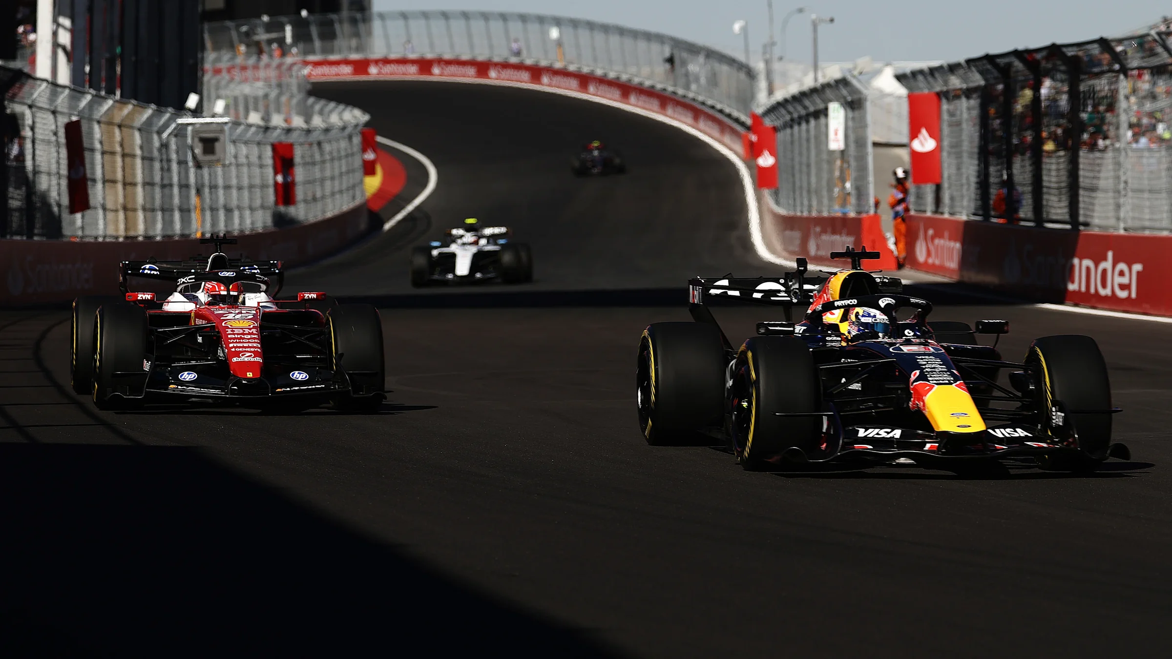 Formula 1 cars running between close barriers at Madring in 2026