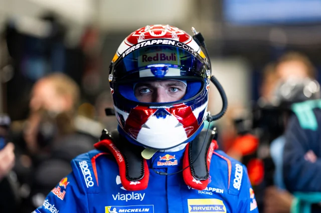 Max Verstappen wearing his helmet in the Verstappen Racing garage at the Nürburgring