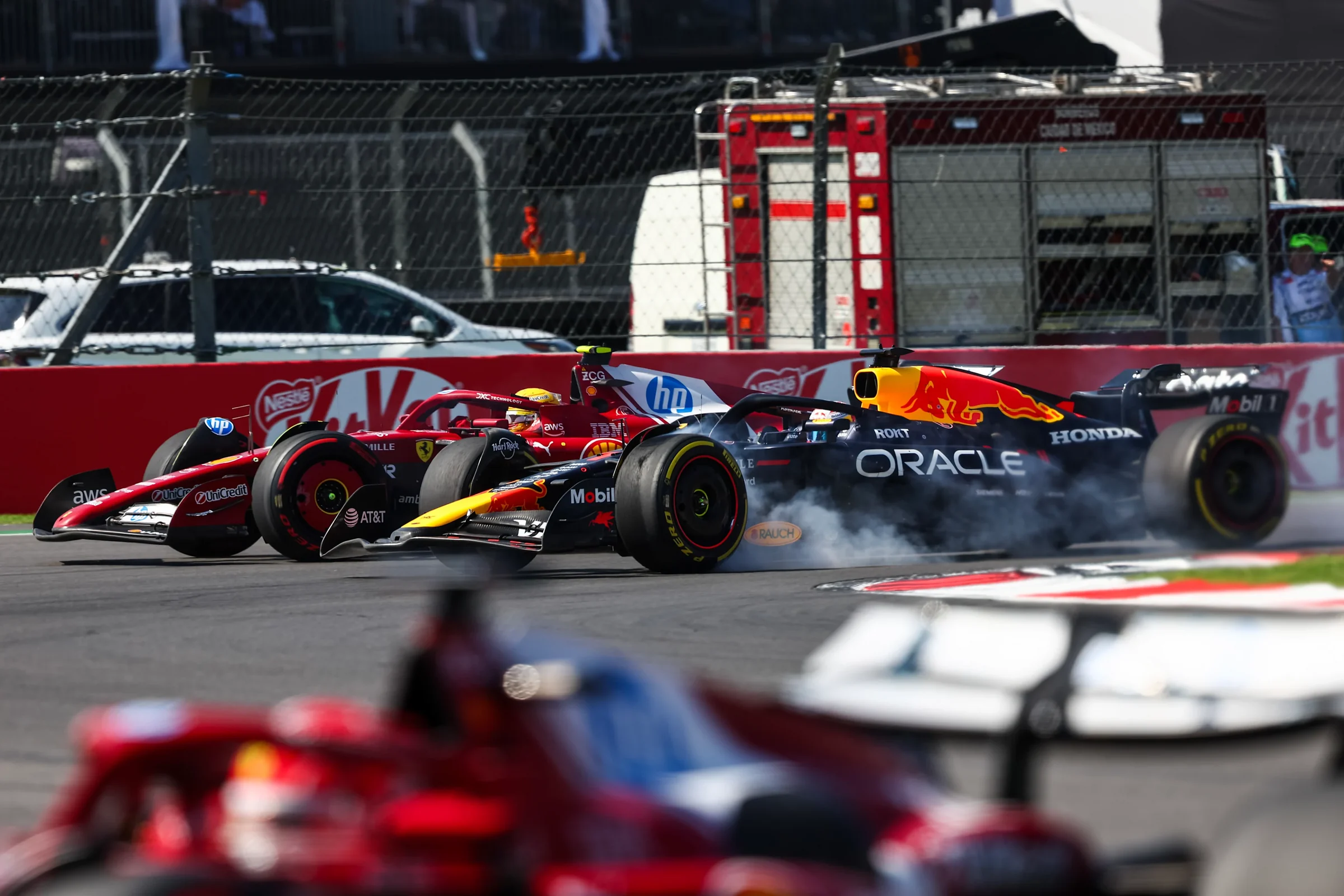 Red Bull and Ferrari Formula 1 cars side by side under braking